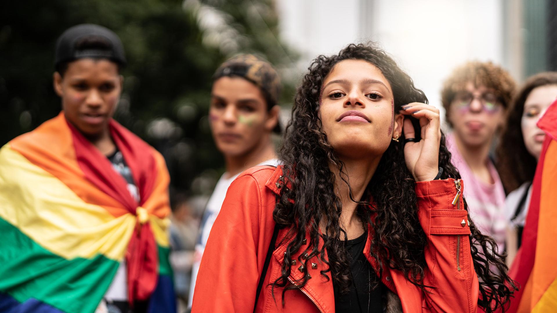 Young woman and rainbow flag 